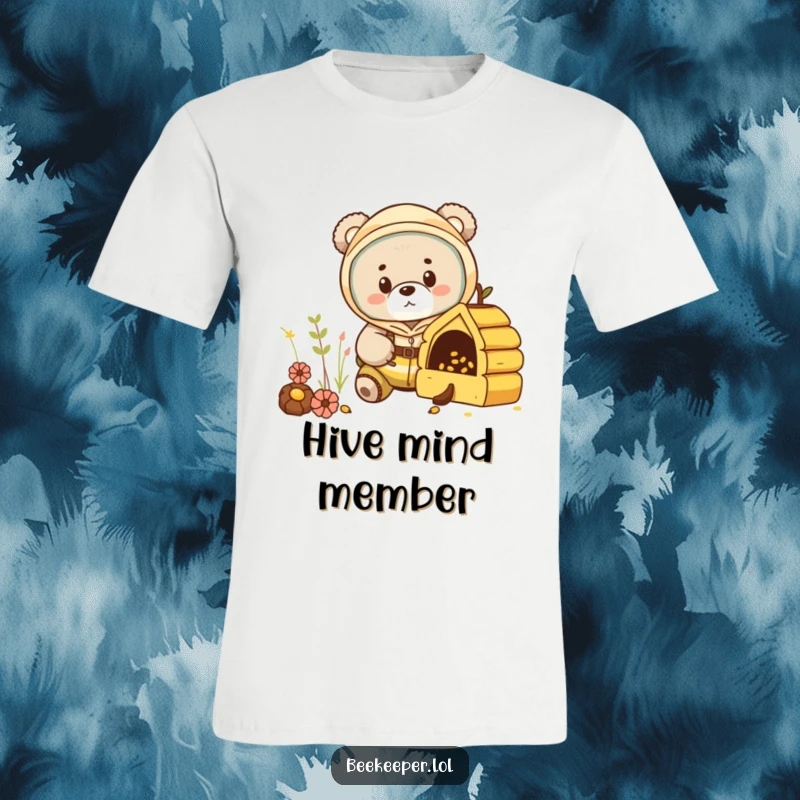 Funny bear cub in a beekeeper suit, peeking into a miniature hive on a t-shirt, embodying playful investigation.